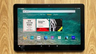 The Amazon Fire HD 10 Kids Pro on a wooden surface