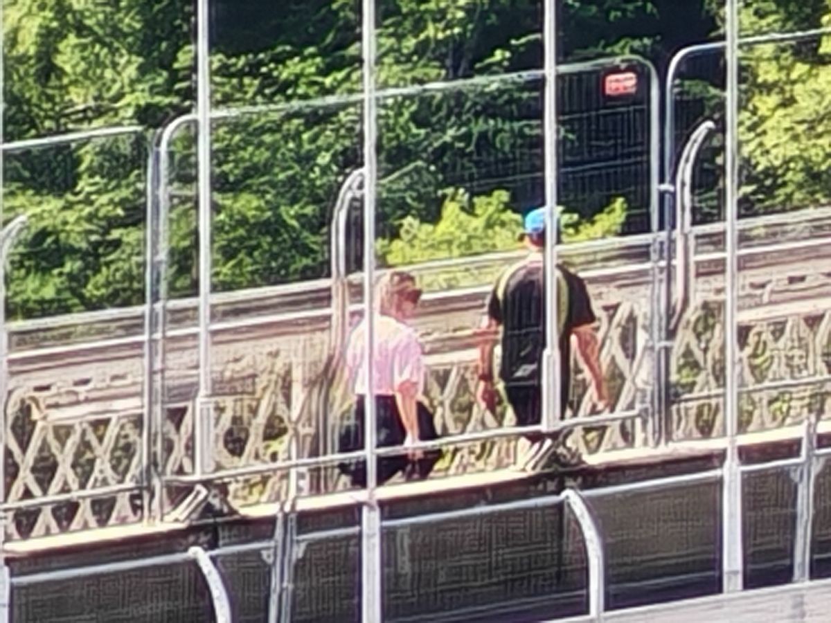Another zoomed-in shot taken on the Honor 400 Pro showing a suspension bridge focused on two people