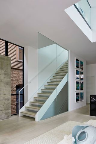 Staircase at House 1909 by Studio Dwell, a metal-clad house in Chicago