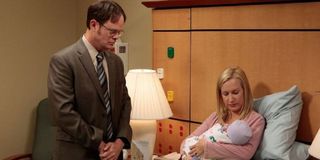 Dwight looking at Angela's new child in The Office.