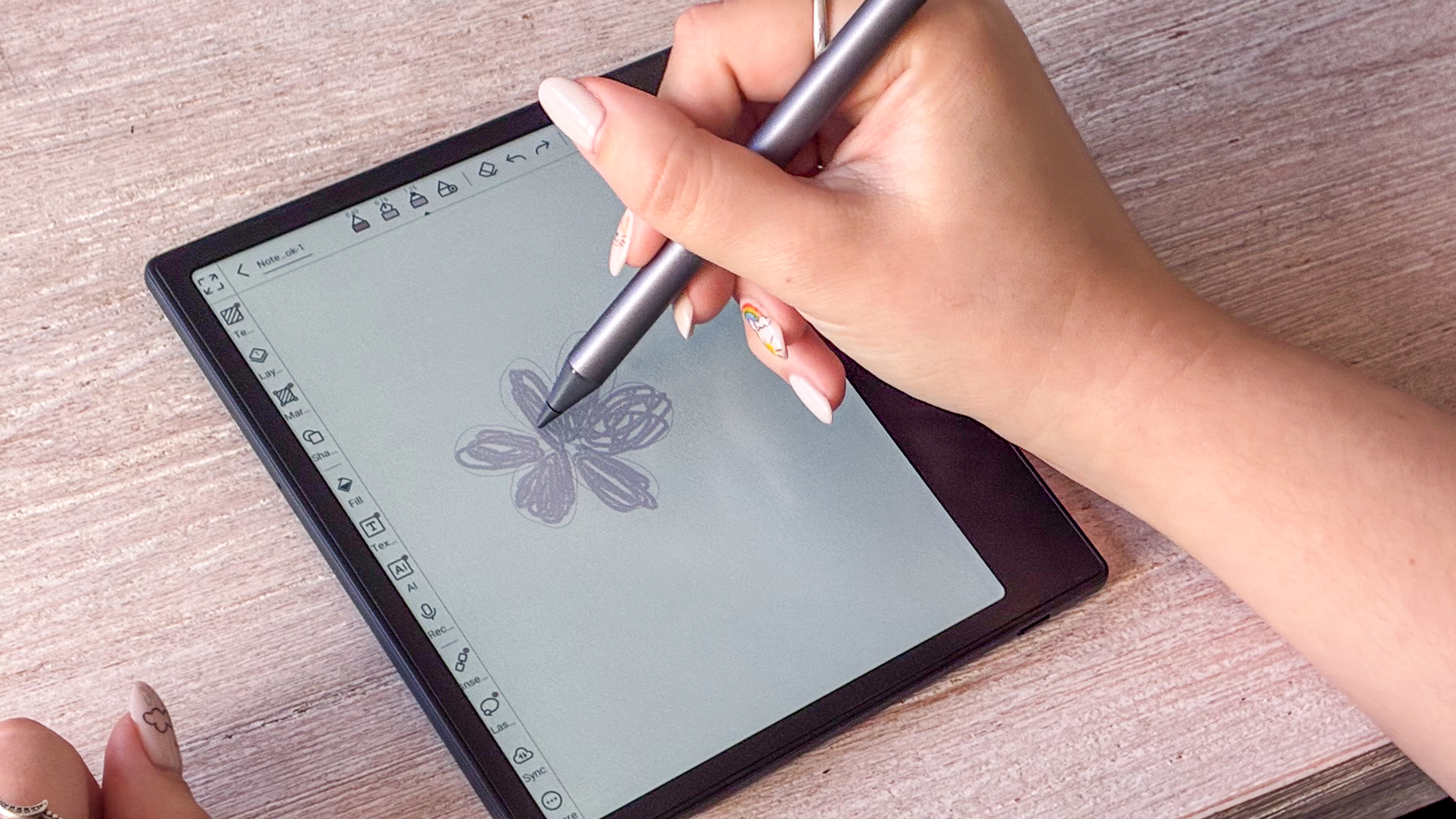 A person drawing on the Boox Go Color 7 Gen II ereader