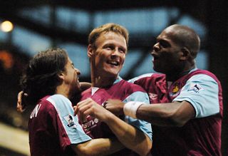 Teddy Sheringham celebrates with his West Ham team-mates after scoring against West Brom in 2005.