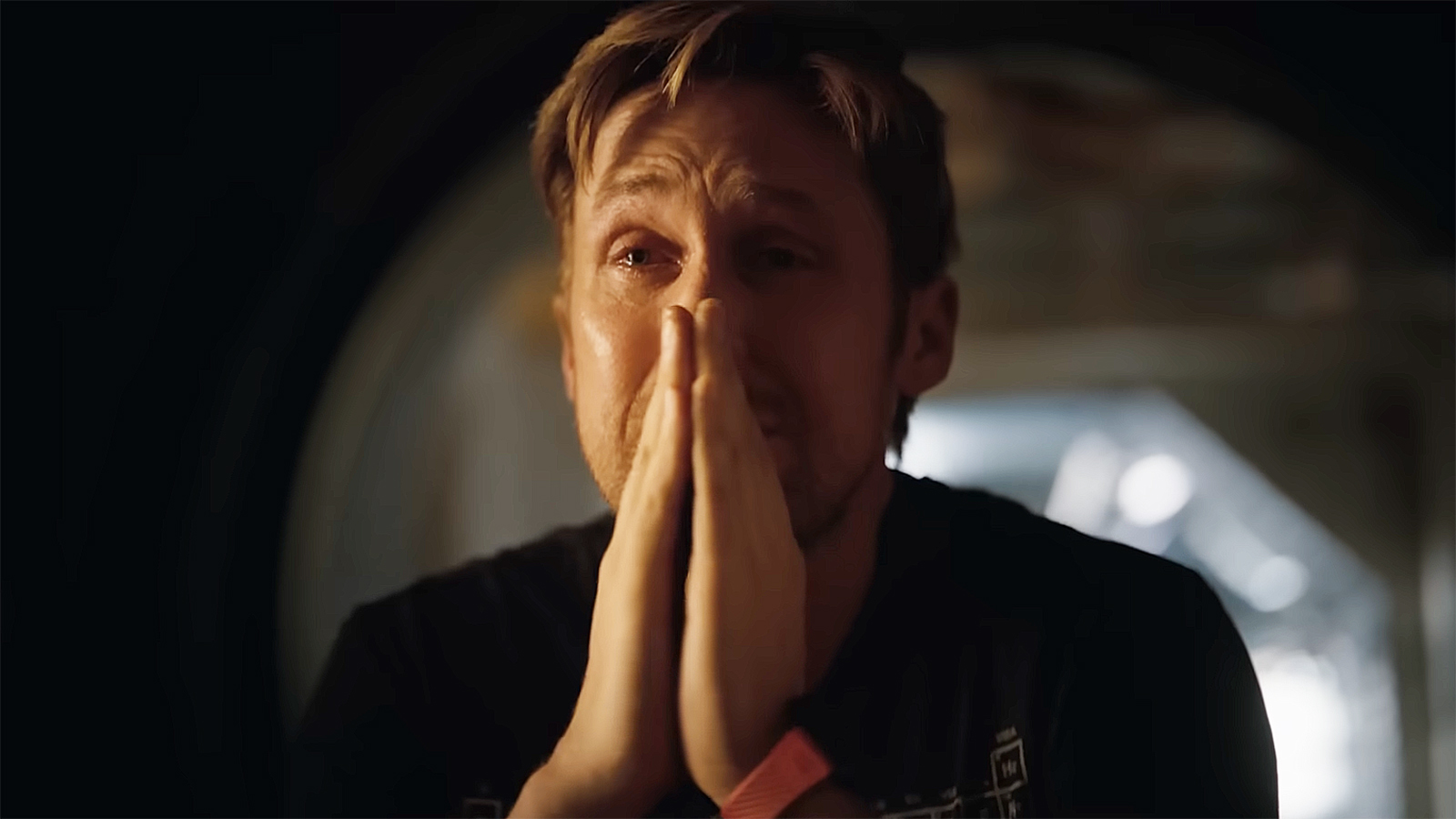 Ryland Grace crying and with hands praying in Project Hail Mary