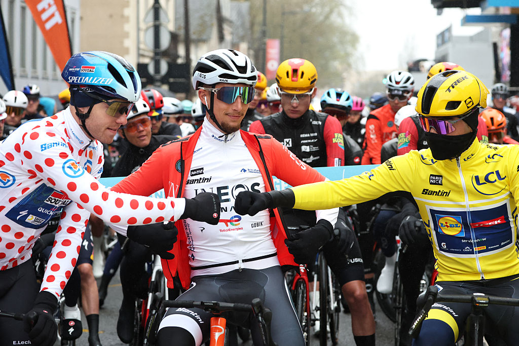 Soudal Quick-Step's Danish rider Casper Pedersen (L), wearing the white with red polka dots best climber's jersey, INEOS Grenadiers' French rider K&amp;eacute;vin Vauquelin and Lidl - Trek's Spanish rider Juan Ayuso (R), wearing the overall leader yellow jersey, greet each other at the start of the 4th stage of the Paris-Nice cycling race, 195 km between Bourges and Uchon, on March 11, 2026. (Photo by Anne-Christine POUJOULAT / AFP)