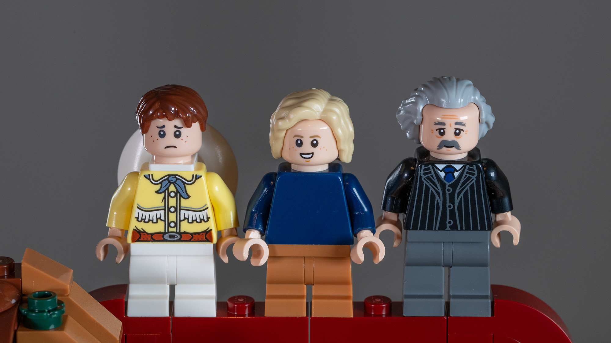 Lego Ideas Willy Wonka & the Chocolate Factory (21360) set Minifigures: Mike, Charlie, and Grandpa Joe.
