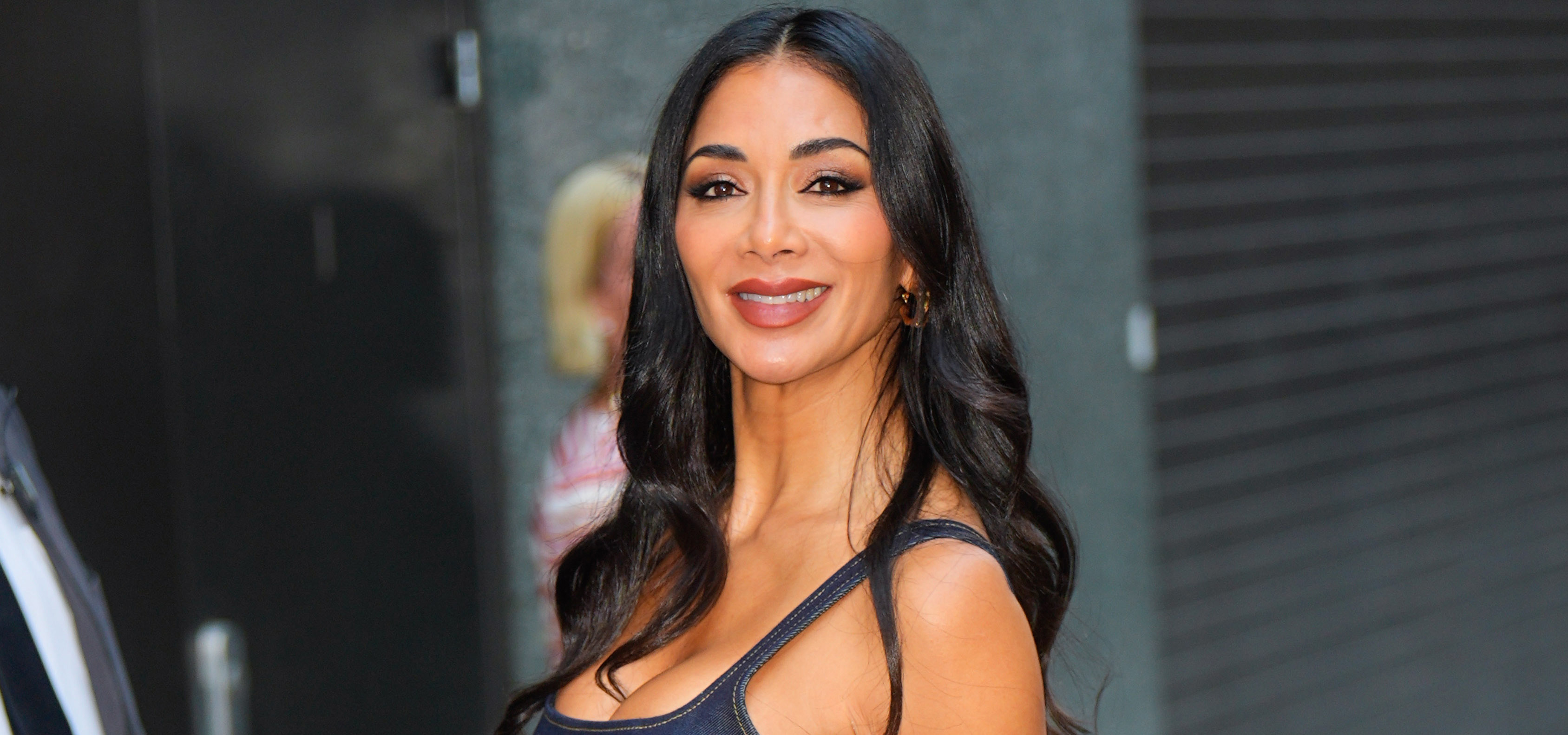 Nicole Scherzinger wearing a denim dress