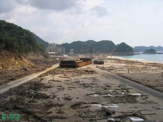 A coal barge and tug carried onto land in Lho Nga, Sumatra in 2004. The tsunami runup reached 104 feet (32 m) here.