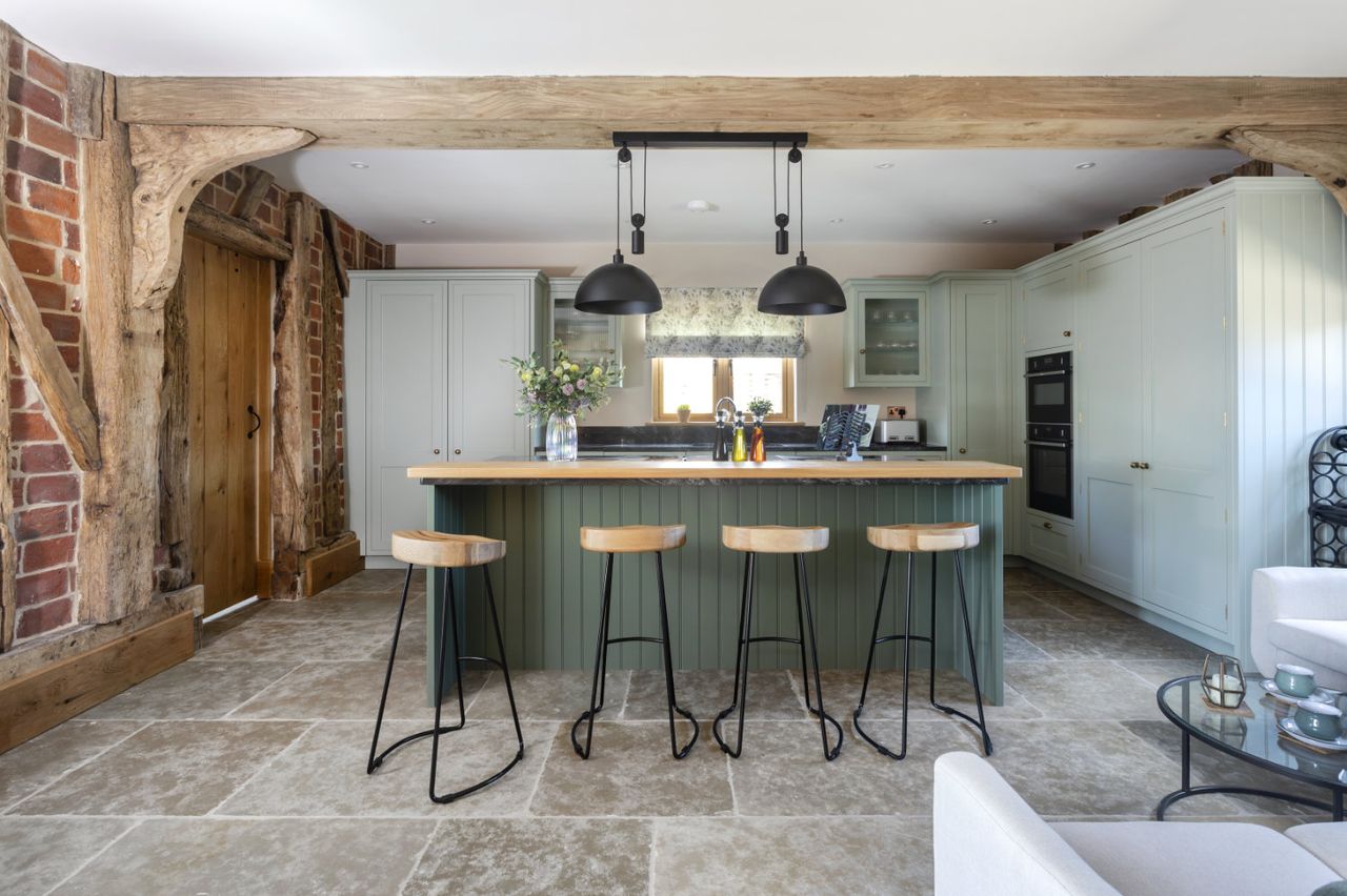 A barn conversion kitchen with a kitchen island with seating