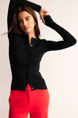 woman wearing black ribbed fitted cardigan