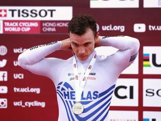 Christos Volikakis on the podium of the Men's Scratch Race during the 2019 UCI Track Cycling World Cup in Hong Kong