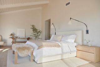 Fur rug, wooden bedside tables, cream bed