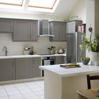 kitchen with chimney and cabinets