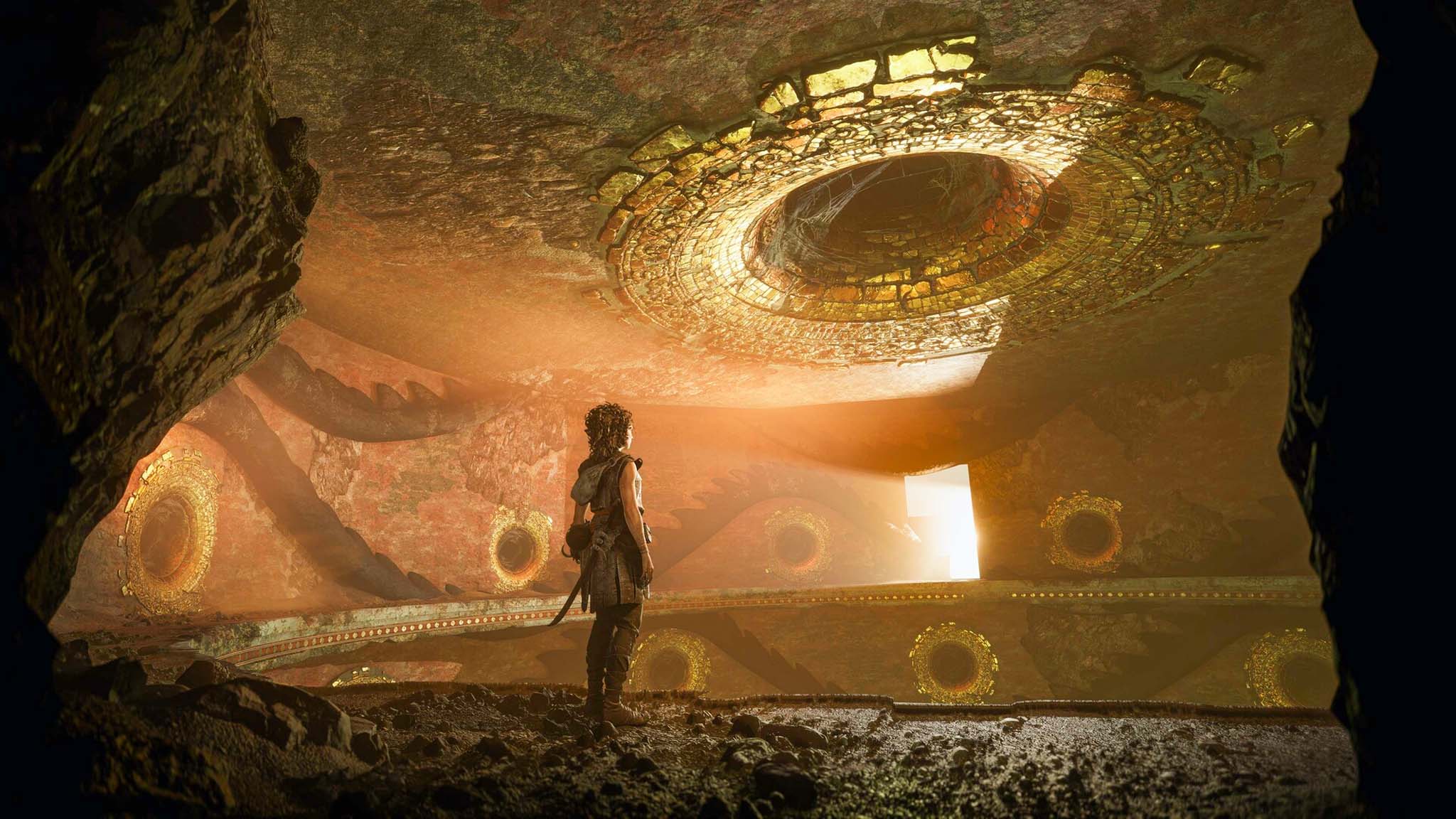 Screenshot from Resonance: A Plague Tale Legacy showing a girl looking up at a large hole in the cieling.