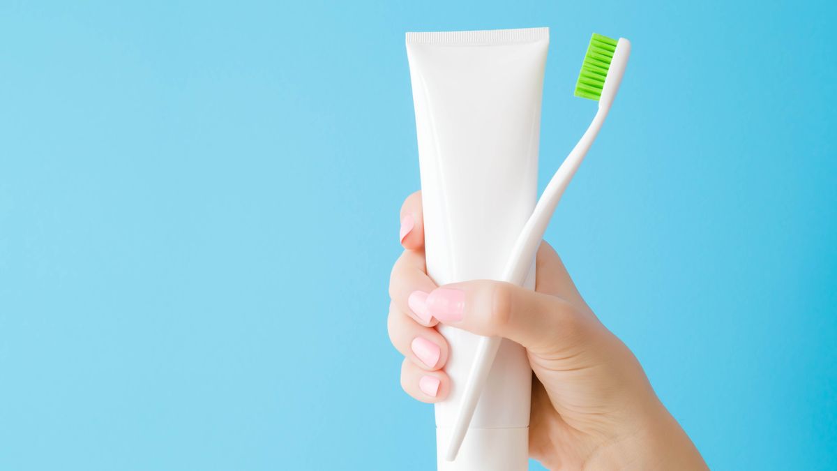 Toothpaste and brush in hand