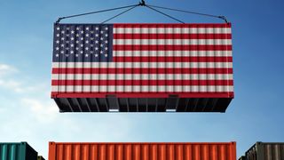 A container emblazoned with the US flag being lowered onto an orange container flanked by green and black containers, representing US tariffs on imports and the US supply chain.