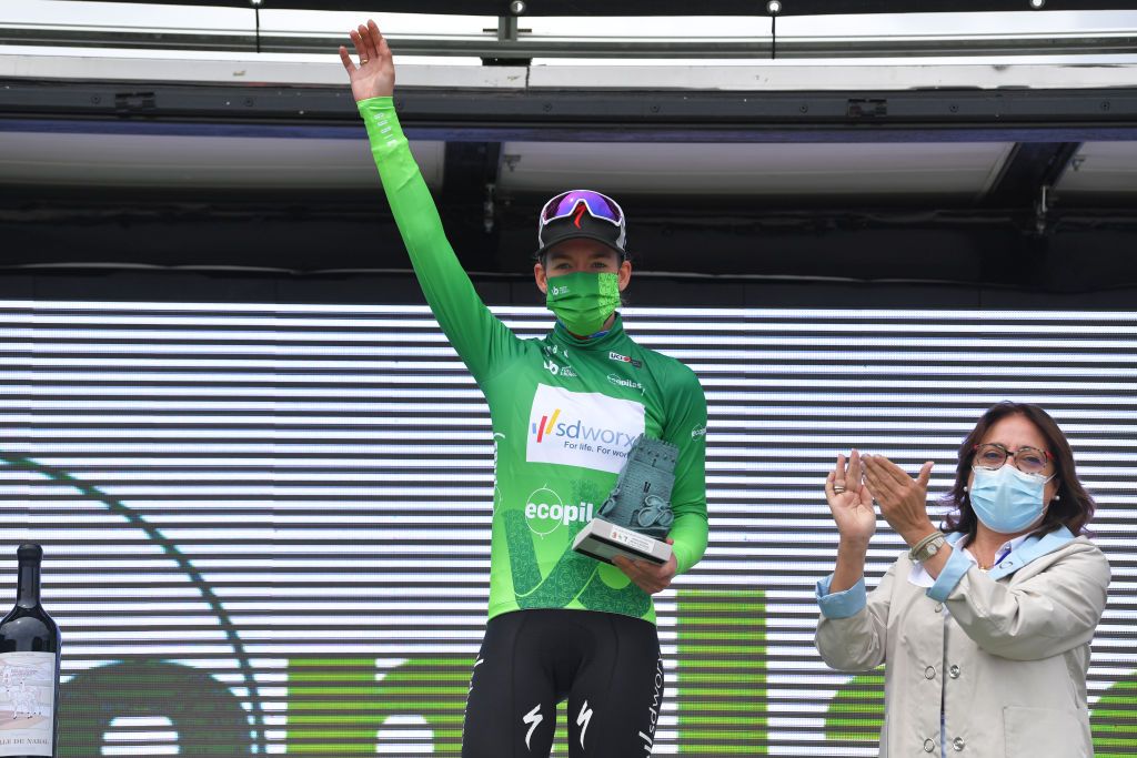 LAGUNAS DE NEILA SPAIN MAY 23 Anna Van Der Breggen of Netherlands and Team SD Worx Green Points Jersey celebrates at podium during the 6th Vuelta A Burgos Feminas 2021 Stage 4 a 1216km stage from Quintanar de la Sierra to Lagunas De Neila 1870m VueltaBurgos BurgosFem UCIWWT on May 23 2021 in Lagunas De Neila Spain Photo by Luc ClaessenGetty Images