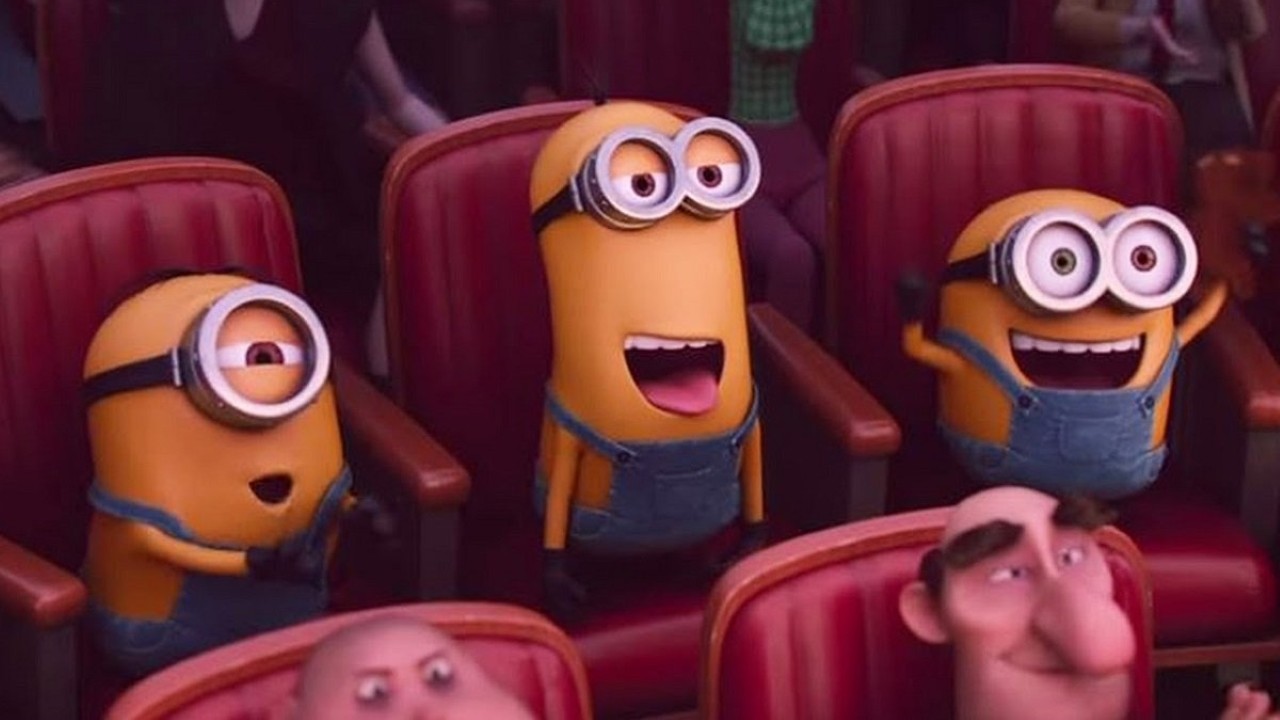 Happy Minions sitting in a theater