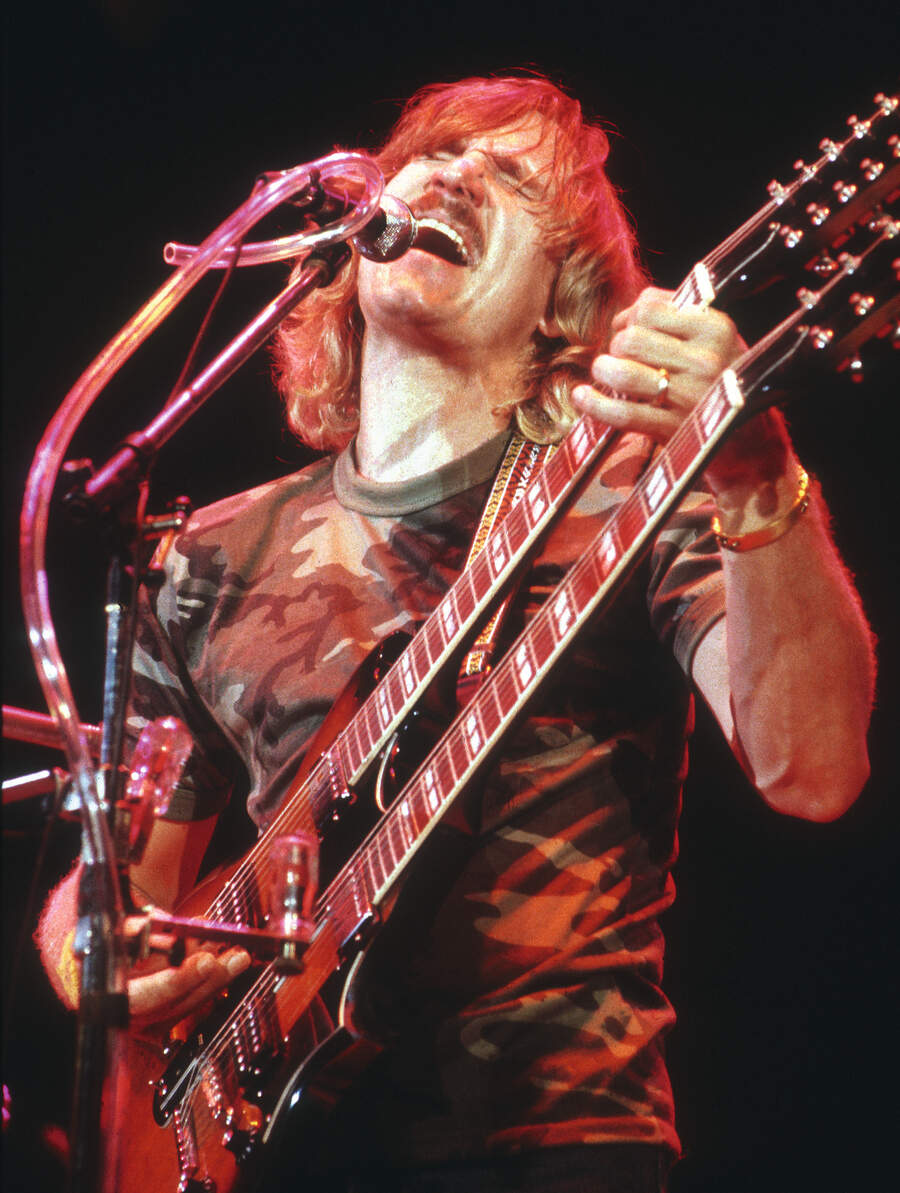 Musician Joe Walsh of the rock band 'Eagles' performs onstage in circa 1976 in Los Angeles.