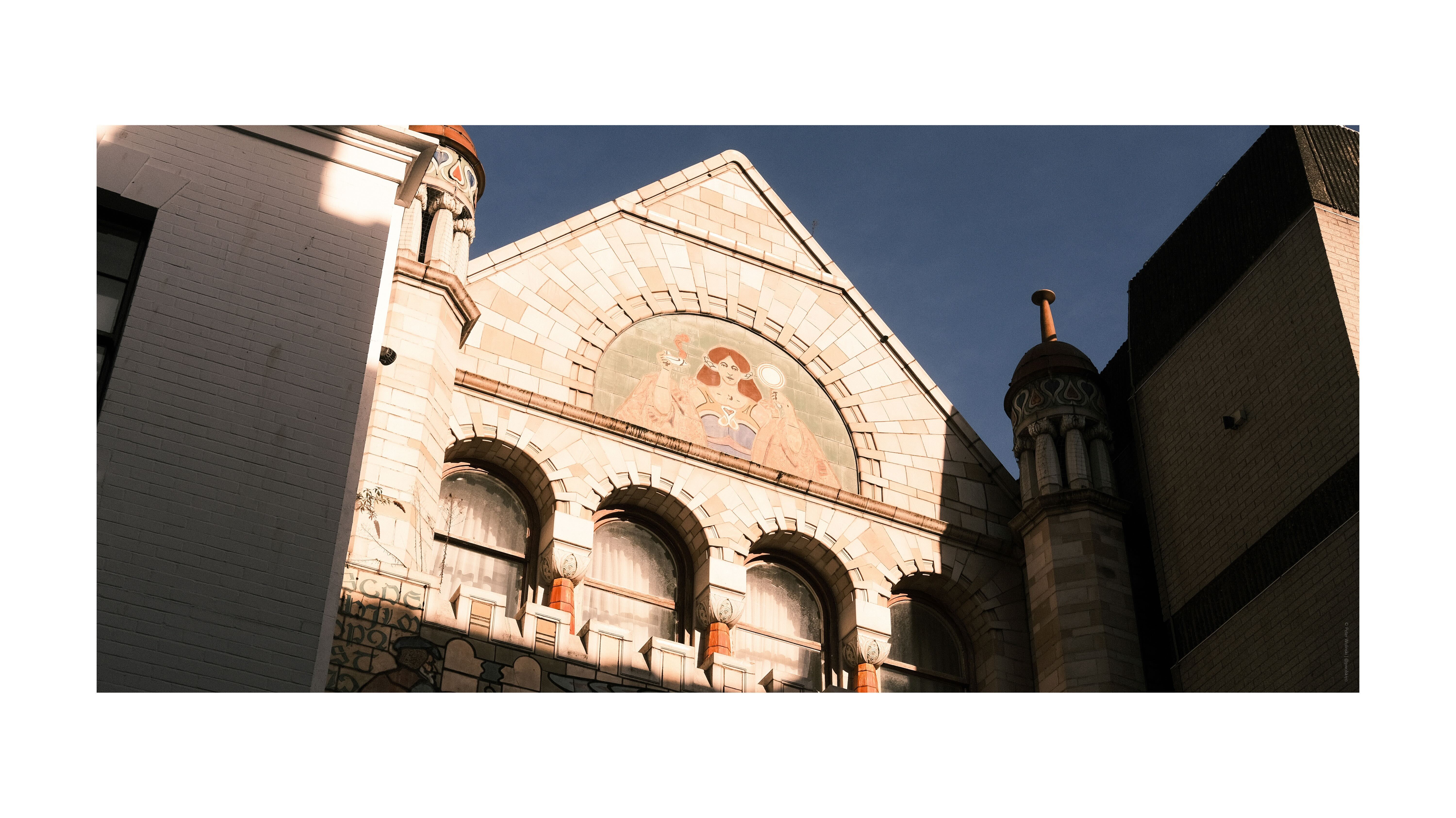 A photo of old buildings in Bristol, with blue skies, taken on the Fujifilm X-E4