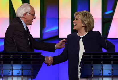 Bernie Sanders and Hillary Clinton shake hands at the first primetime Democratic debate of the 2016 election.