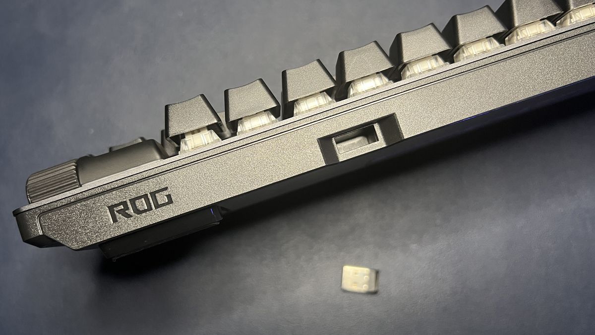 Top of ROG Strix Scope II 96 Wireless keyboard showing dongle storage