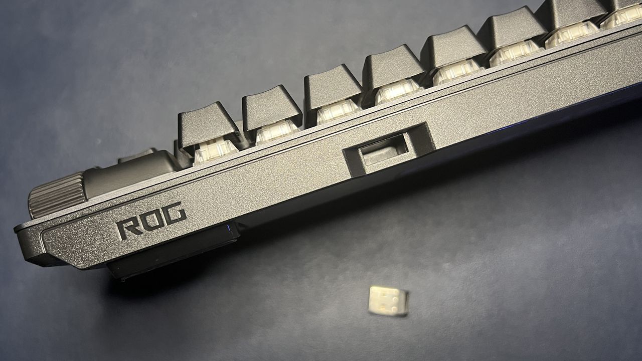 Top of ROG Strix Scope II 96 Wireless keyboard showing dongle storage