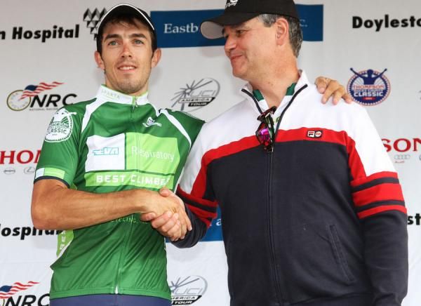 Diego Milan (Firefighters Racing p/b Advocare) is awarded the best climber jersey by a Teva rep.
