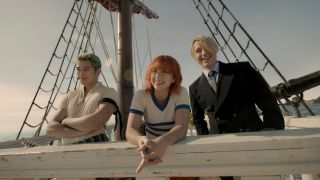 Zoro, Nami and Sanji smiling on board ship in live-action One Piece