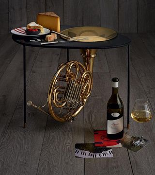 Artist's palate Christian Marclay’s fondue moitié-moitié artist recipes with wine on a trumpet table