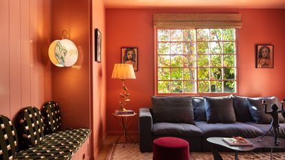 a red room with walls and ceiling painted in the same color