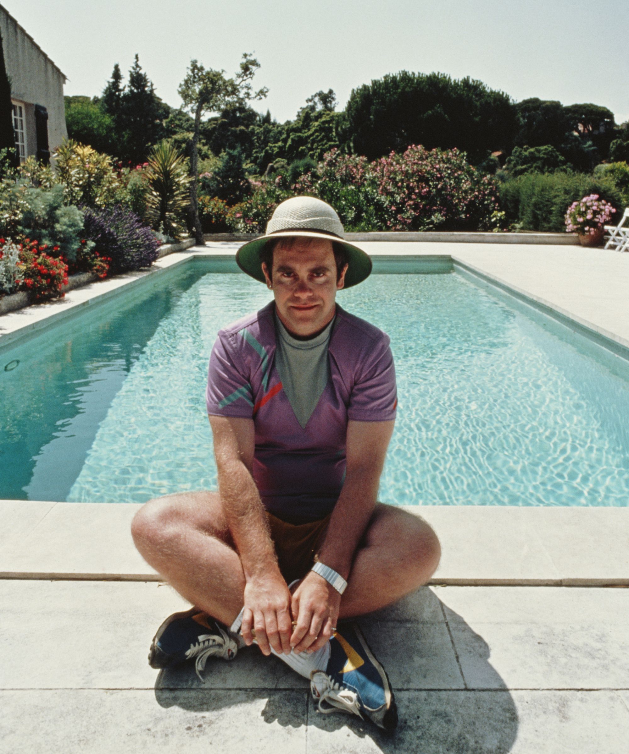 elton john at his pool in the south of france