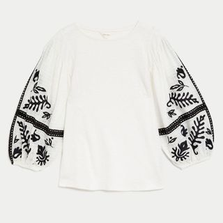 white top with black embroidery