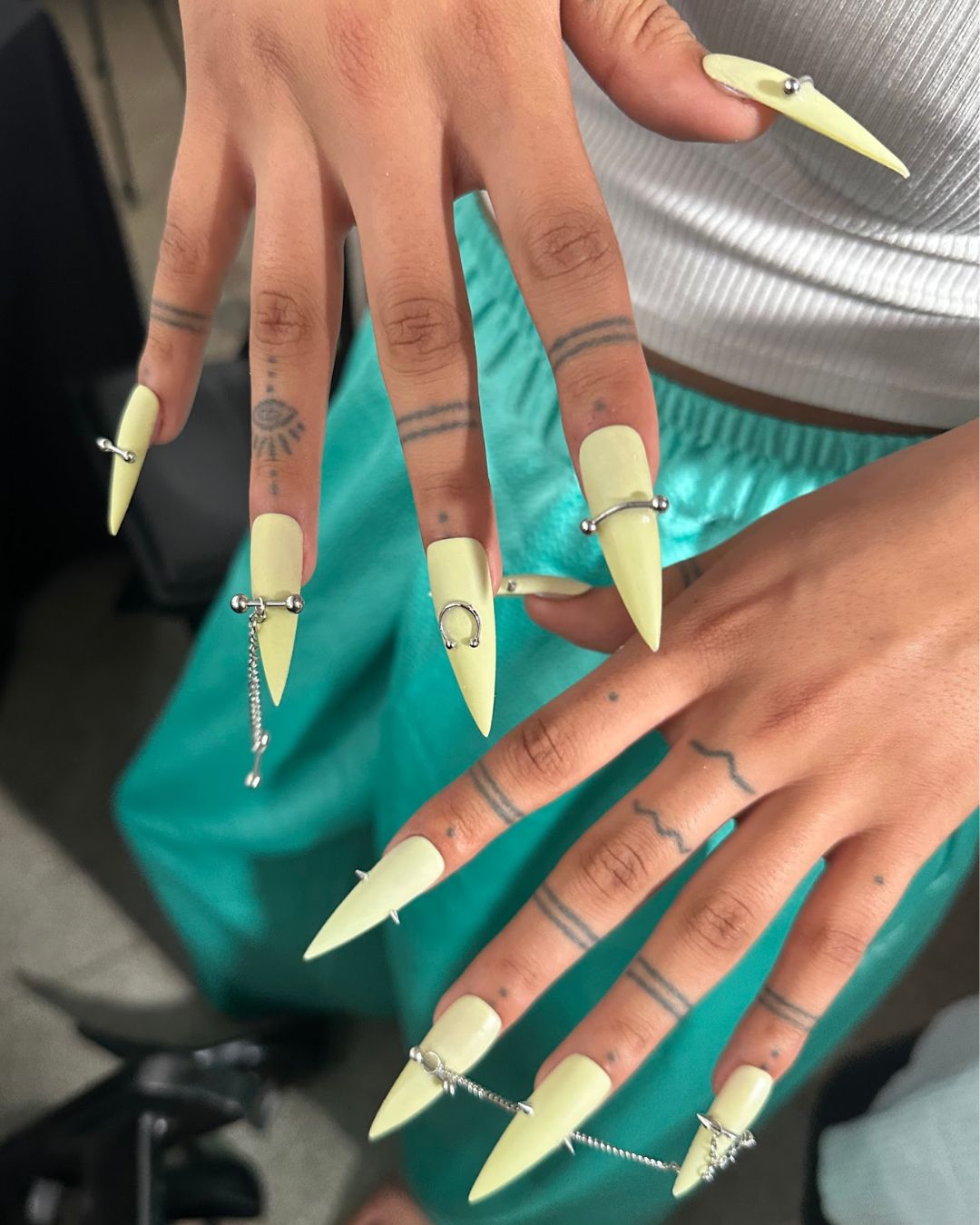 An image of the pierced nails backstage at Grace Ling spring/summer 26.