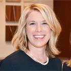 A headshot of Martha Carol-Stewart