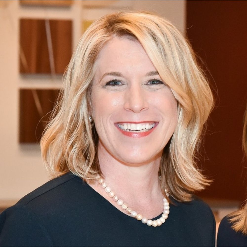 A headshot of Martha Carol-Stewart