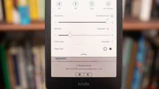 Amazon Kindle Colorsoft Signature edition e-reader showing graphic novels, cookbooks, and fiction, as well as settings