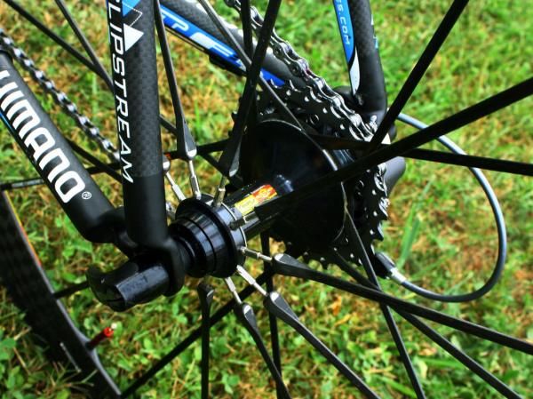 The rear Mavic Cosmic Carbone Ultimate's carbon fibre spokes feature threaded steel ends on the non-driveside to allow for truing.