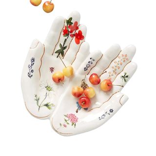 A white hand-shaped painted ceramic serving platter