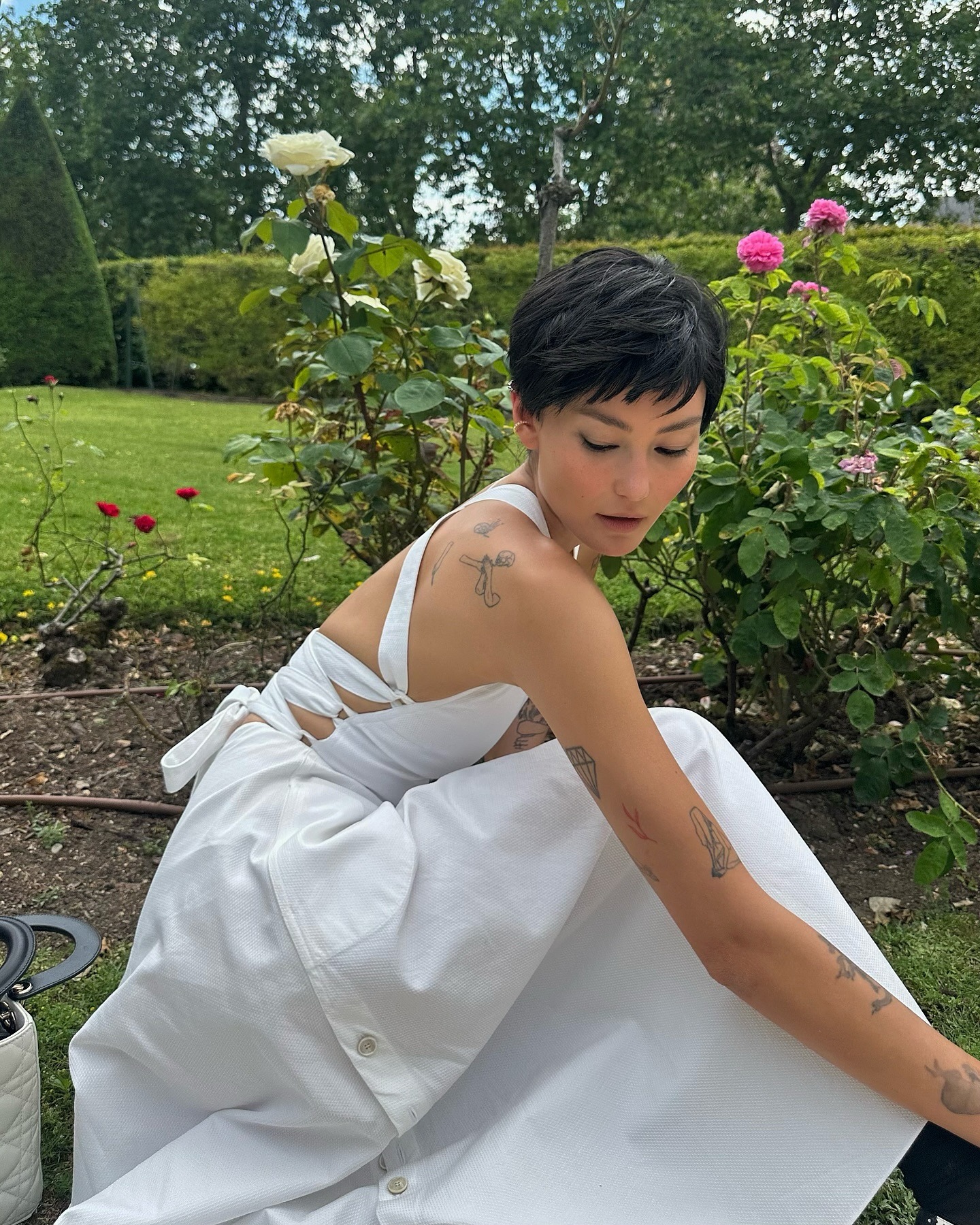 Image of a person wearing an angular pixie hairstyle.