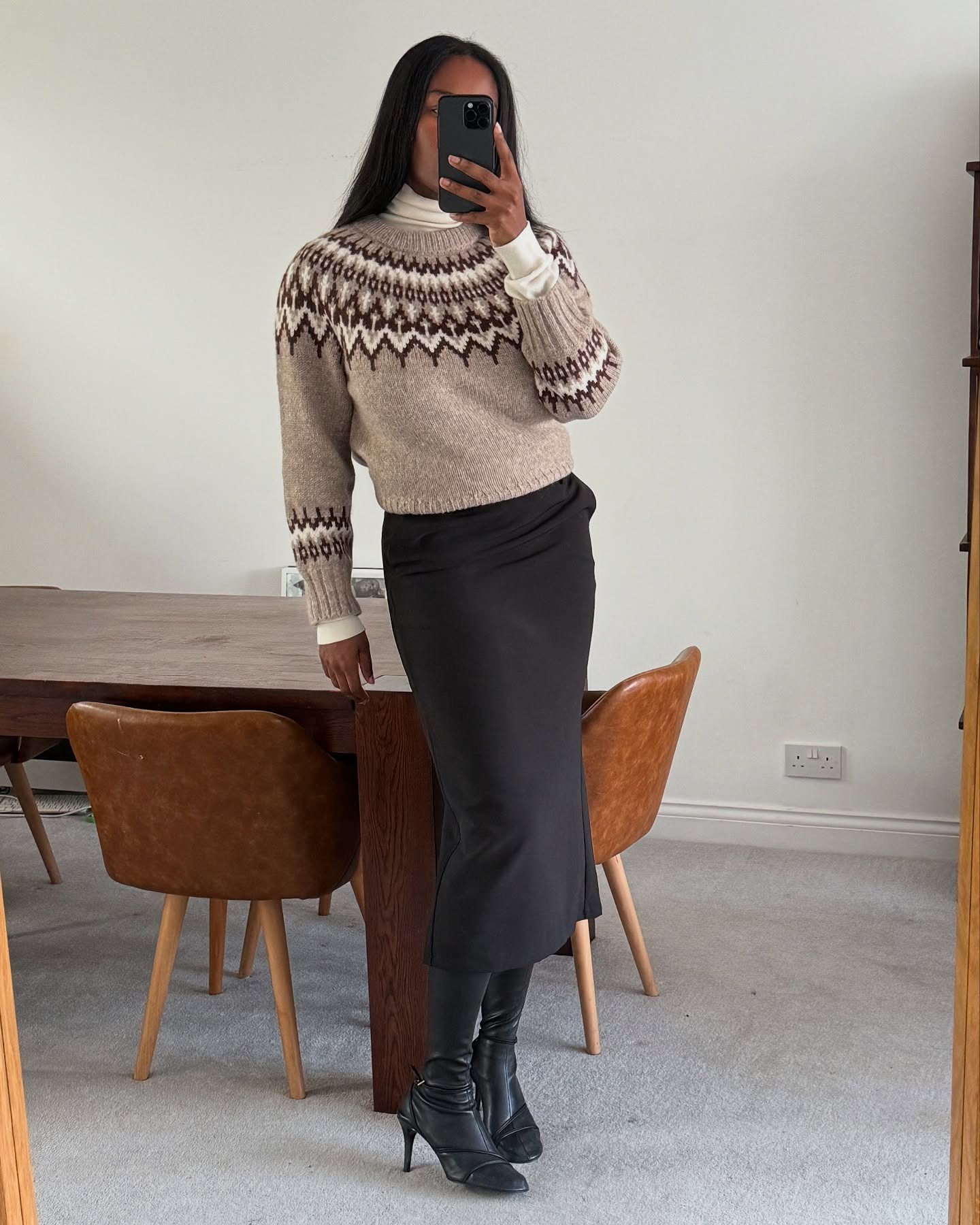 Woman in Fair Isle sweater and skirt.