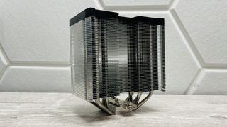 Endorfy Fortis 5 air cooler on a desk and loaded onto a motherboard.