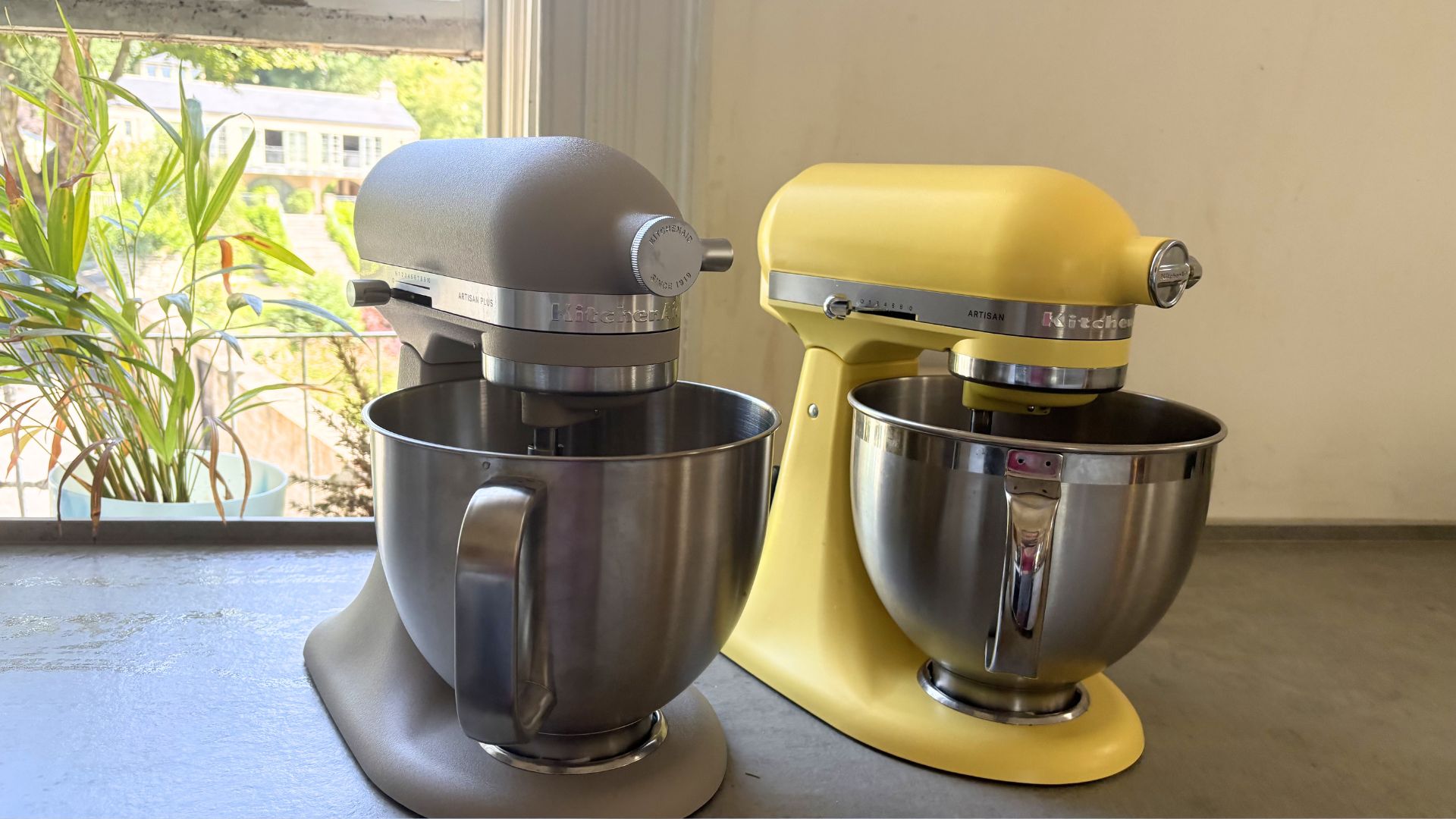 Testing the KitchenAid Artisan Plus Stand Mixer, by putting it next to the butter yellow stand mixer