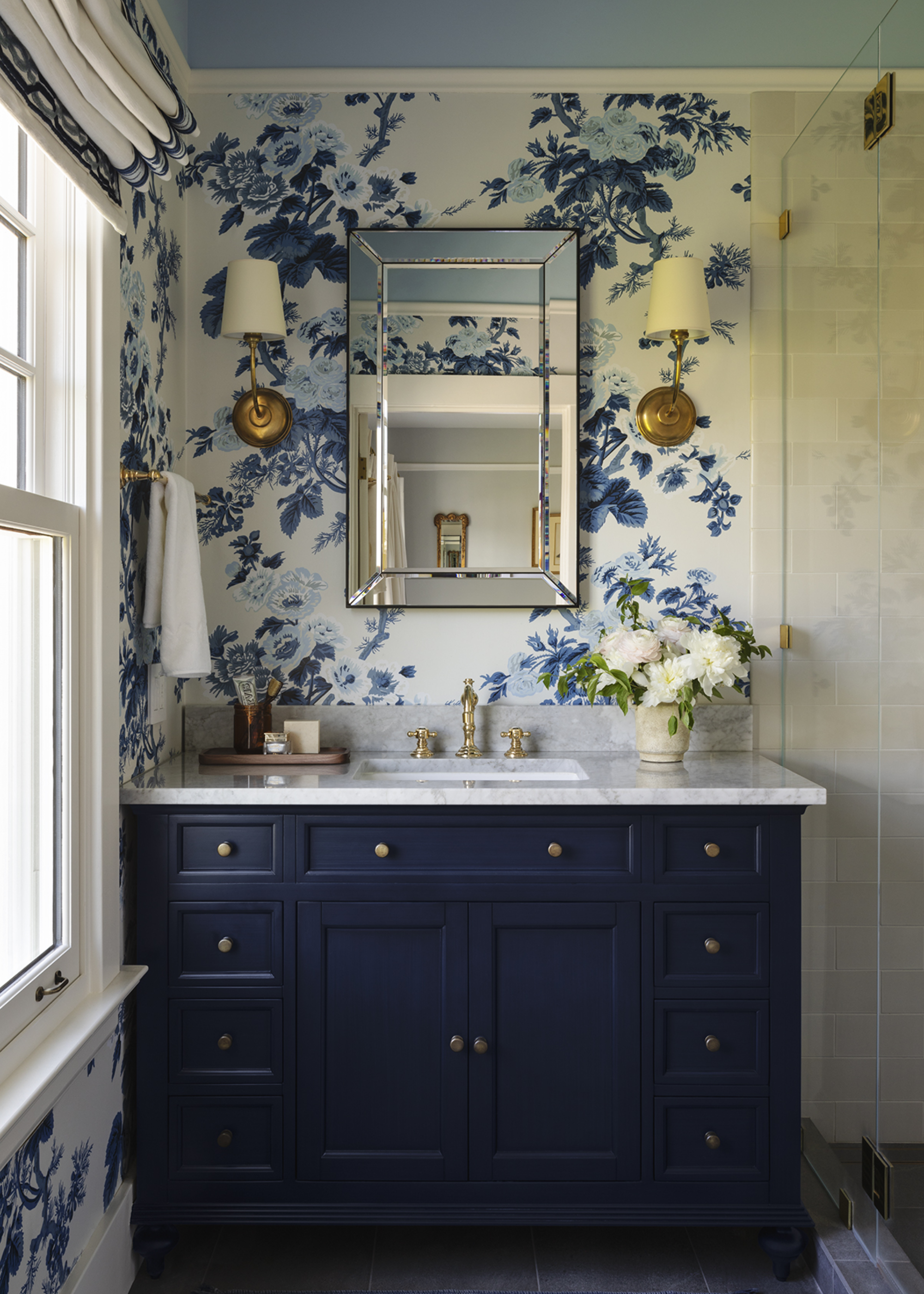 A bathroom with wallpaper