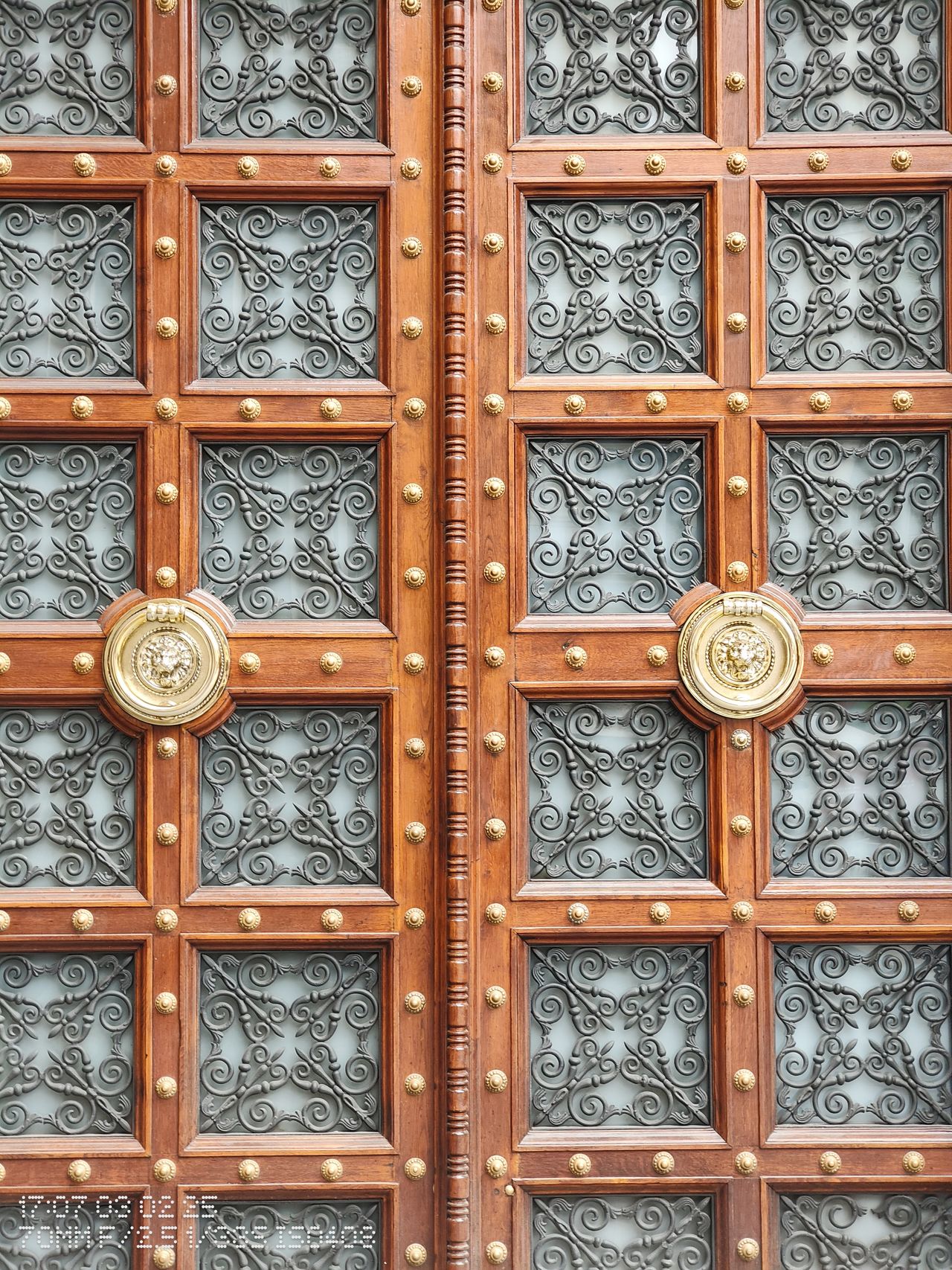 Close up of a large wood and metal door