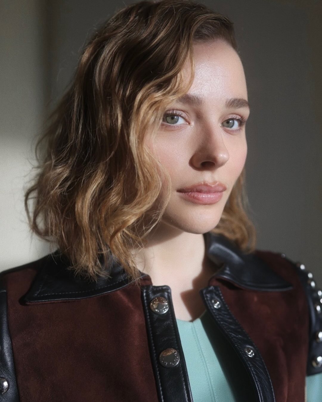 Chlo&amp;euml; Moretz with curly side swept hairstyle