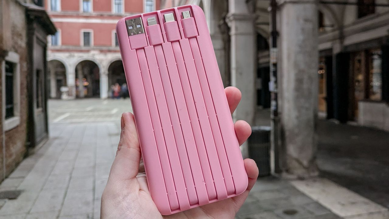Holding a Charmast Portable Charger in Venice