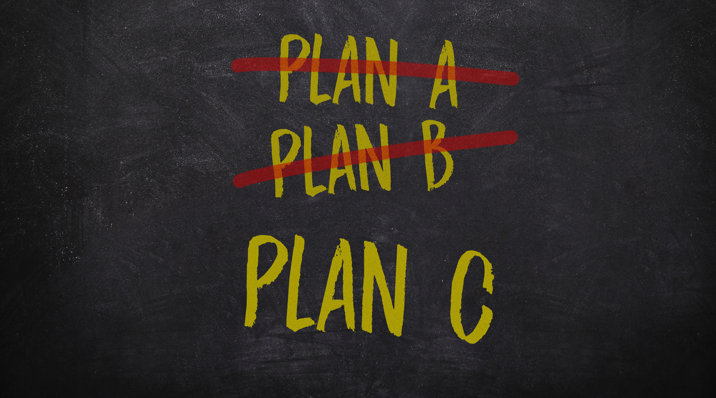 yellow chalk hand writing antonym words plan A, B and C on blackboard