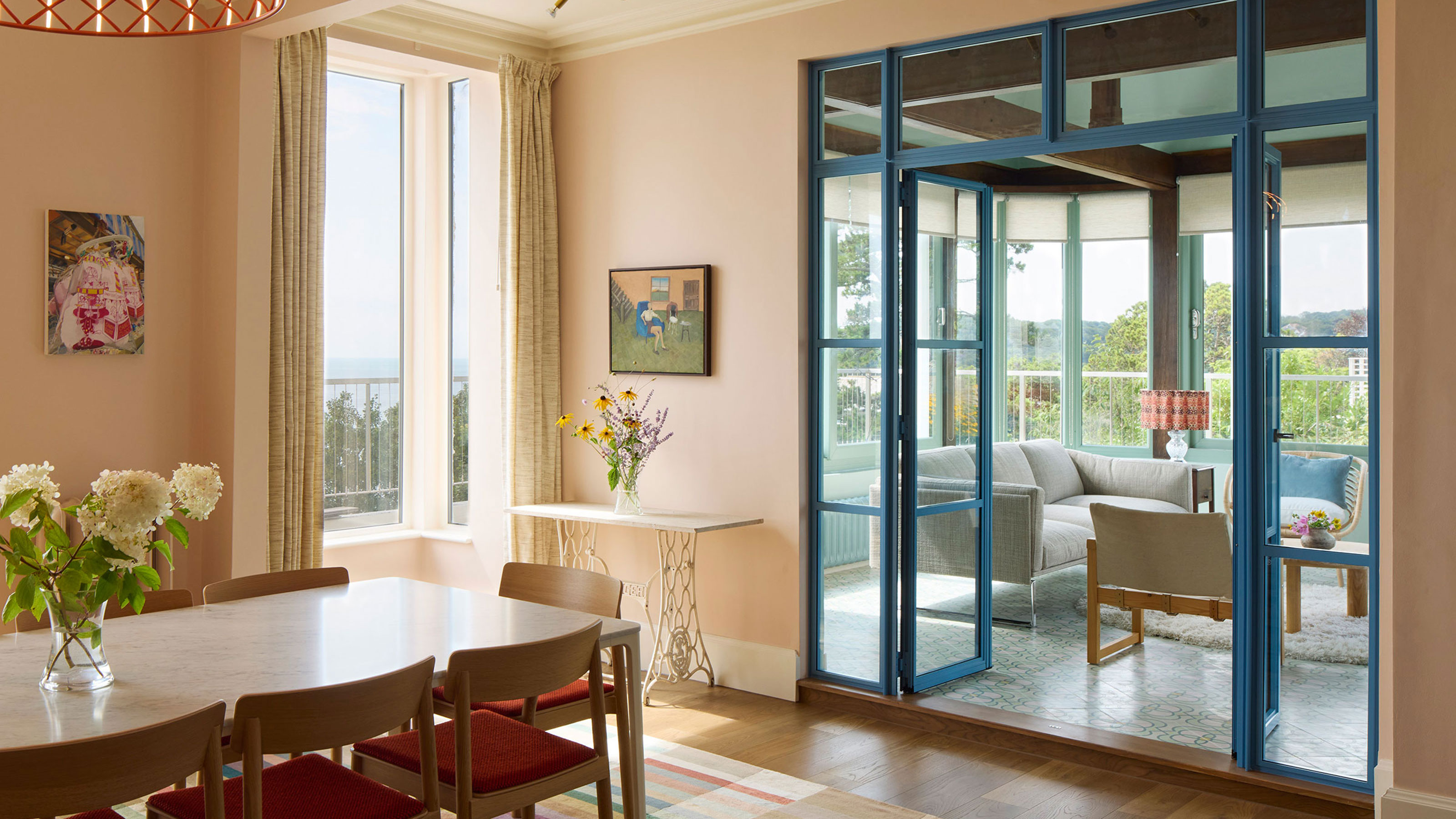 dining room with blue internal French doors leading to conservatory