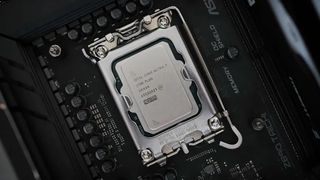 Close-up of an Intel Core i7 CPU seated in a motherboard socket. Surrounding components, circuits, and text labels highlight a tech-focused atmosphere.