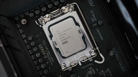 Close-up of an Intel Core i7 CPU seated in a motherboard socket. Surrounding components, circuits, and text labels highlight a tech-focused atmosphere.